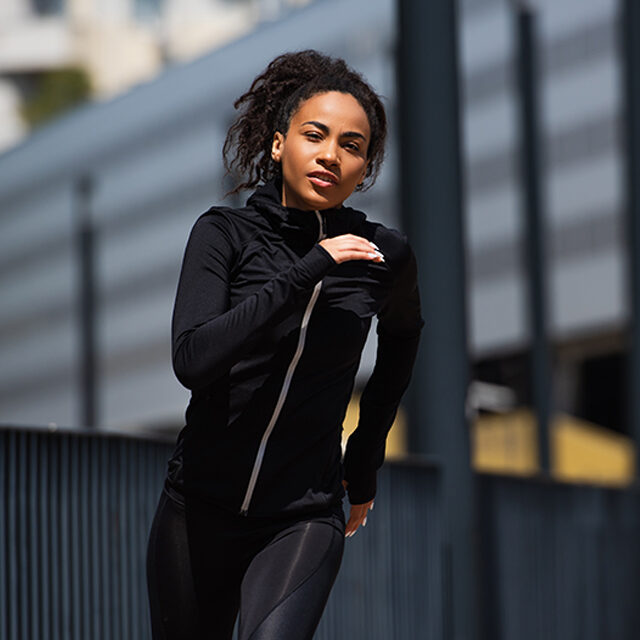 Young and fit african american runner training outdoors
